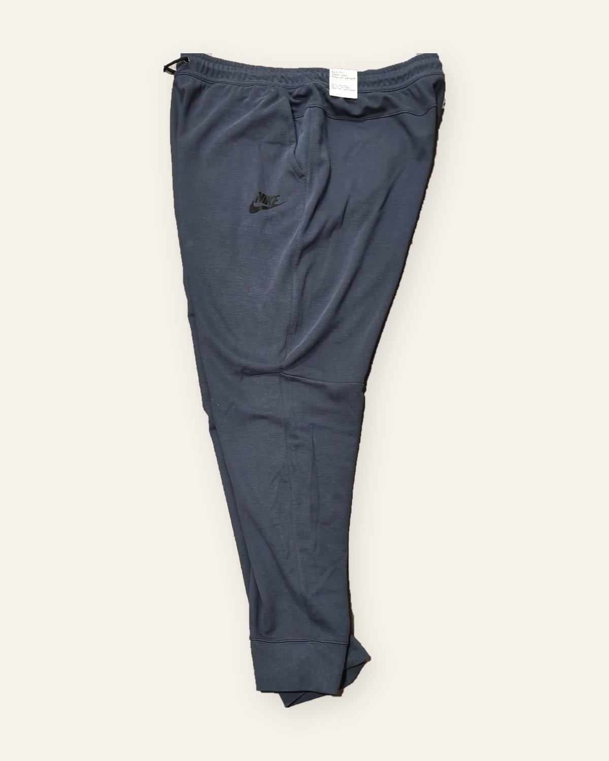 Nike Tech Essentials joggers slate blue – side view with Nike logo