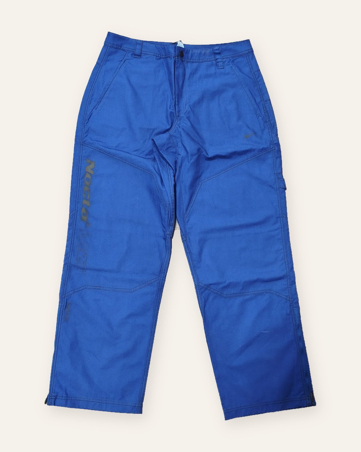 Nike x NOCTA x L'Art pants deep royal blue – front view with NOCTA L'Art print